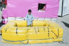 A child stands inside a Water Pond during an exhibition