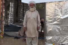 A worker stands outside Chandi Ghar located at Mithi Hospital Tharparkar